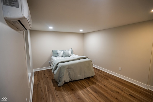 3463 Plum Creek Rd, Nashville, IN 47448 - bedroom featuring a wall mounted air conditioner, dark wood-style floors, recessed lighting, and baseboards