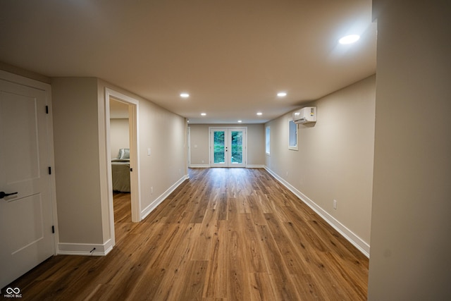 3463 Plum Creek Rd, Nashville, IN 47448 - spare room featuring a wall mounted AC, wood finished floors, baseboards, and recessed lighting