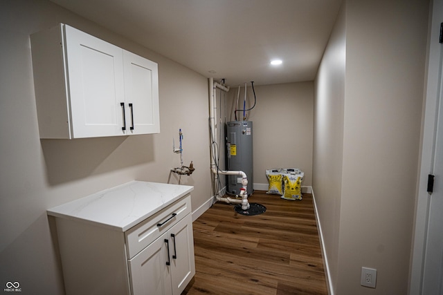 3463 Plum Creek Rd, Nashville, IN 47448 - finished basement featuring electric water heater, dark wood finished floors, baseboards, and recessed lighting