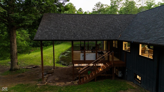 3463 Plum Creek Rd, Nashville, IN 47448 - exterior space featuring roof with shingles, stairs, a deck, and a yard