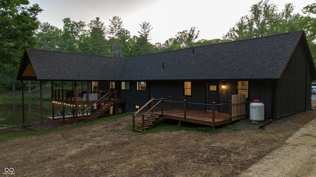 3463 Plum Creek Rd, Nashville, IN 47448 - view of front of home with roof with shingles, stairs, and a deck