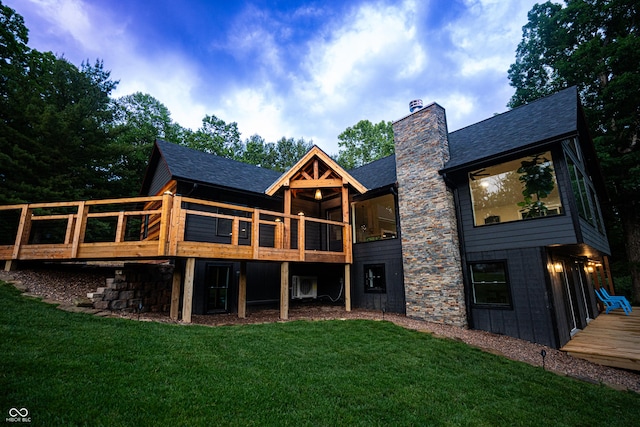 3463 Plum Creek Rd, Nashville, IN 47448 - rear view of house with a yard, roof with shingles, a deck, and a chimney