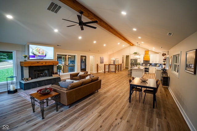 3463 Plum Creek Rd, Nashville, IN 47448 - living area featuring wood finished floors, baseboards, a tiled fireplace, a chandelier, and recessed lighting