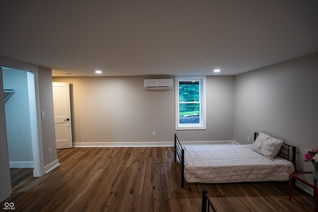 3463 Plum Creek Rd, Nashville, IN 47448 - bedroom featuring a wall unit AC, wood finished floors, baseboards, and recessed lighting