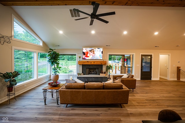 3463 Plum Creek Rd, Nashville, IN 47448 - living area with a tiled fireplace, a ceiling fan, recessed lighting, plenty of natural light, and high vaulted ceiling