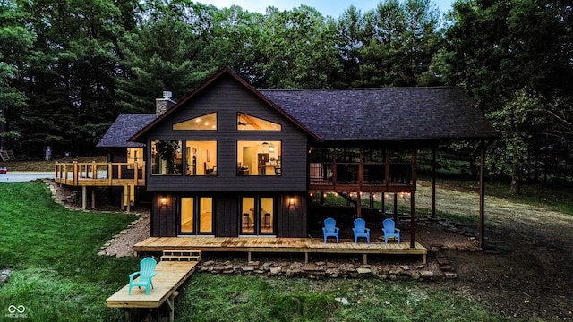 3463 Plum Creek Rd, Nashville, IN 47448 - back of property featuring a wooden deck, a yard, a chimney, and roof with shingles