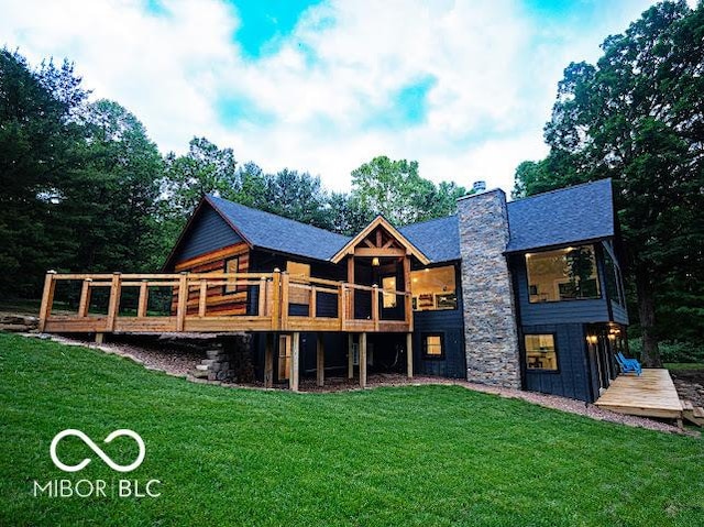 3463 Plum Creek Rd, Nashville, IN 47448 - rear view of property with a wooden deck, a chimney, and a lawn