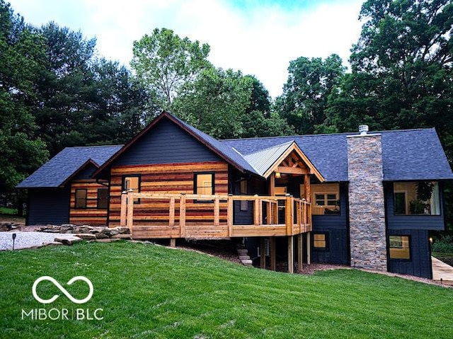 3463 Plum Creek Rd, Nashville, IN 47448 - back of property featuring a lawn, a wooden deck, and a chimney