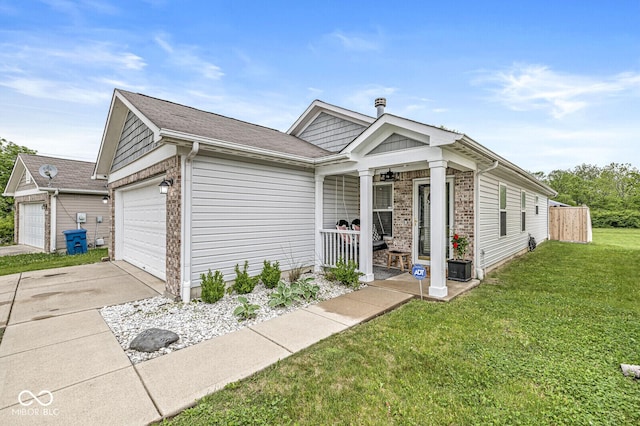 4167 Apple Creek Dr, Indianapolis, IN 46235 - view of front facade featuring a garage, a front lawn, concrete driveway, a porch, and brick siding