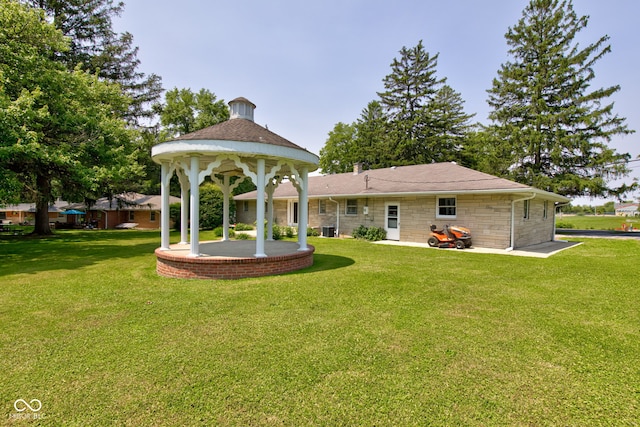 132 S First St, Jamestown, IN 46147 - rear view of house with a yard and a gazebo
