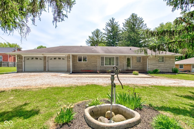 132 S First St, Jamestown, IN 46147 - ranch-style house with a front yard, an attached garage, and driveway
