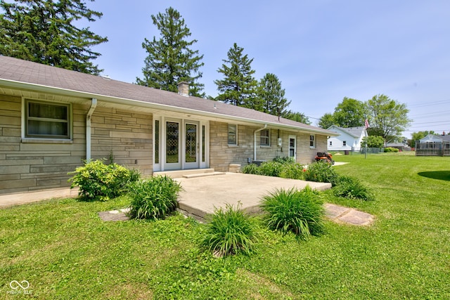 132 S First St, Jamestown, IN 46147 - back of house featuring stone siding, a yard, french doors, and a patio area