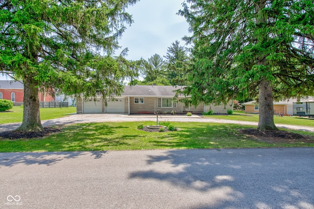 132 S First St, Jamestown, IN 46147 - view of front facade featuring curved driveway, an attached garage, and a front lawn