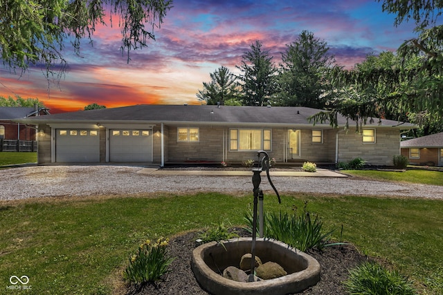 132 S First St, Jamestown, IN 46147 - ranch-style home with a front yard, an attached garage, and driveway