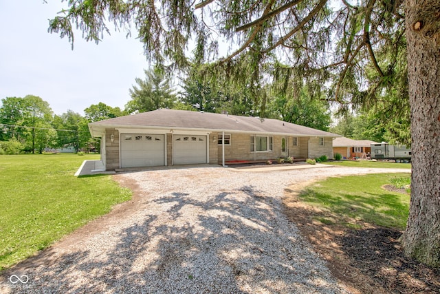 132 S First St, Jamestown, IN 46147 - ranch-style home featuring a garage, gravel driveway, and a front lawn