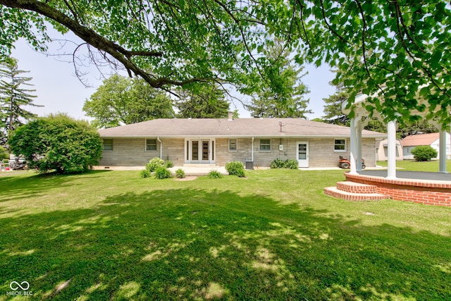 132 S First St, Jamestown, IN 46147 - back of property with a lawn and french doors
