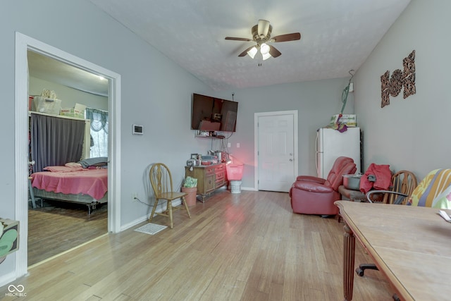 952 Lasalle St, Indianapolis, IN 46201 - living area with light wood finished floors, ceiling fan, and baseboards