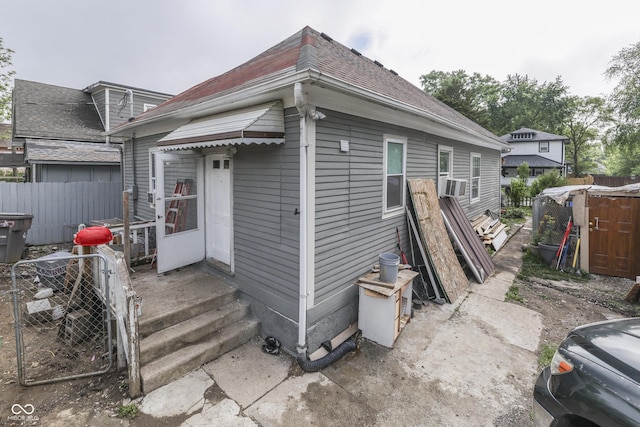 952 Lasalle St, Indianapolis, IN 46201 - rear view of property featuring roof with shingles and cooling unit