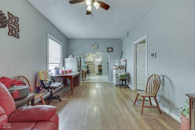 952 Lasalle St, Indianapolis, IN 46201 - living area featuring arched walkways, wood finished floors, ceiling fan, and baseboards