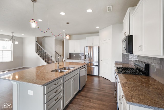 6830 Park Grove Blvd, Whitestown, IN 46075 - kitchen featuring appliances with stainless steel finishes, a sink, a kitchen island with sink, recessed lighting, and decorative backsplash