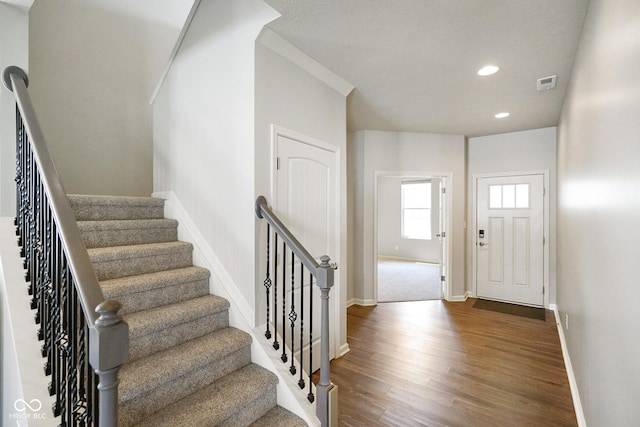 6830 Park Grove Blvd, Whitestown, IN 46075 - entryway with dark wood-style flooring, baseboards, recessed lighting, and stairway