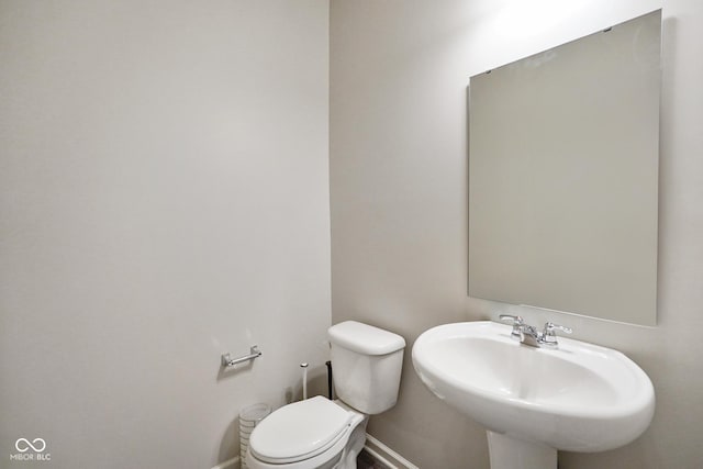 6830 Park Grove Blvd, Whitestown, IN 46075 - bathroom featuring toilet, a sink, and baseboards