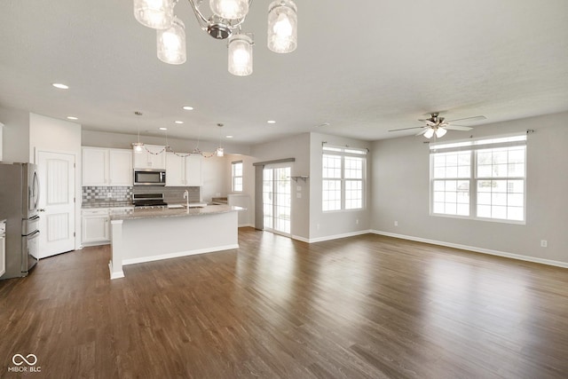 6830 Park Grove Blvd, Whitestown, IN 46075 - kitchen with stainless steel appliances, recessed lighting, dark wood finished floors, baseboards, and backsplash