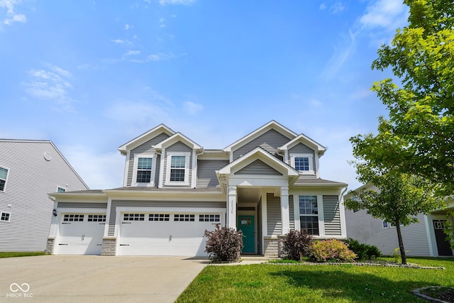 6830 Park Grove Blvd, Whitestown, IN 46075 - craftsman inspired home featuring driveway, a front lawn, stone siding, and an attached garage