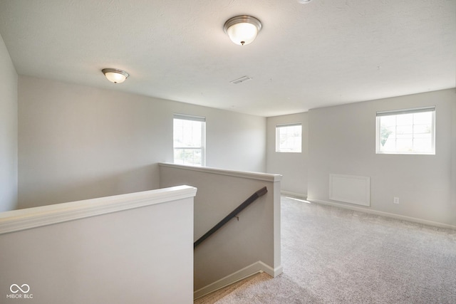 6830 Park Grove Blvd, Whitestown, IN 46075 - hall featuring an upstairs landing, carpet, and baseboards