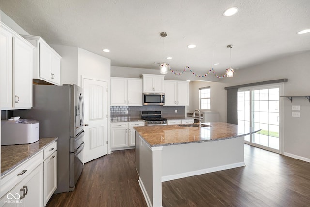 6830 Park Grove Blvd, Whitestown, IN 46075 - kitchen with stainless steel appliances, a sink, white cabinetry, dark wood-style flooring, and decorative backsplash