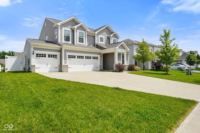 6830 Park Grove Blvd, Whitestown, IN 46075 - view of front of property with driveway, an attached garage, a gate, and stone siding