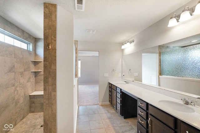 6830 Park Grove Blvd, Whitestown, IN 46075 - bathroom with double vanity, tile patterned floors, walk in shower, and baseboards