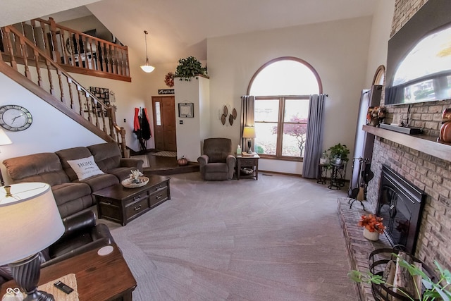 3819 S Village Dr, New Palestine, IN 46163 - living room featuring carpet floors, a fireplace, high vaulted ceiling, healthy amount of natural light, and stairs
