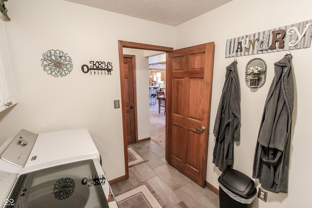 3819 S Village Dr, New Palestine, IN 46163 - laundry area with cabinet space, washing machine and dryer, and baseboards