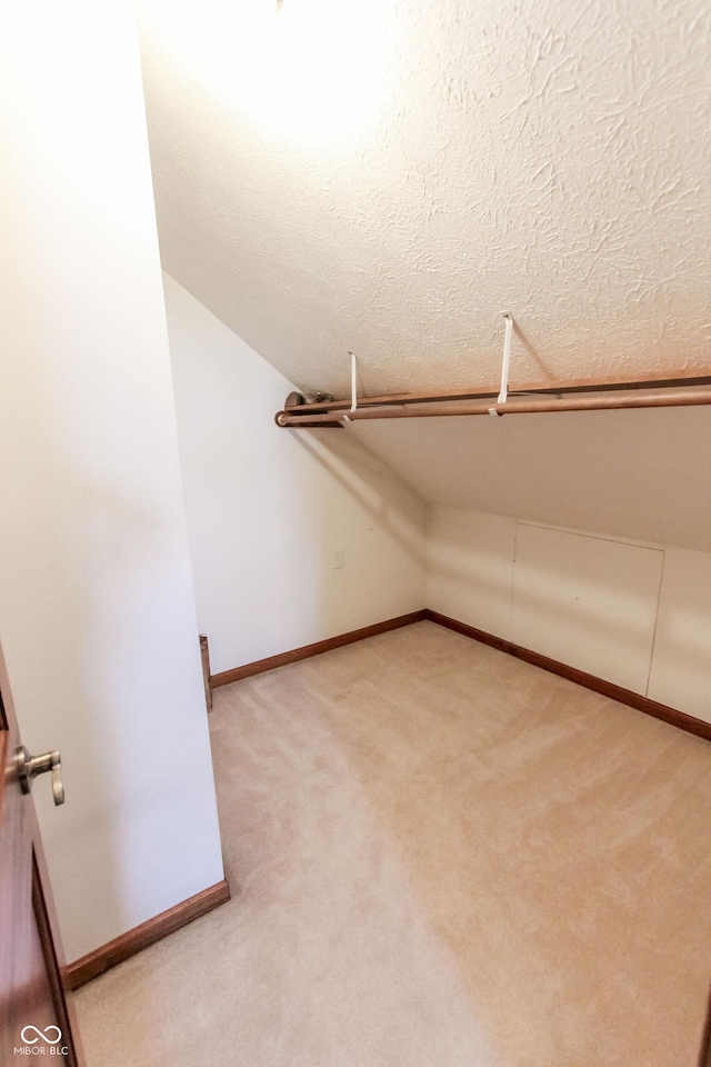 3819 S Village Dr, New Palestine, IN 46163 - spacious closet with vaulted ceiling and light carpet