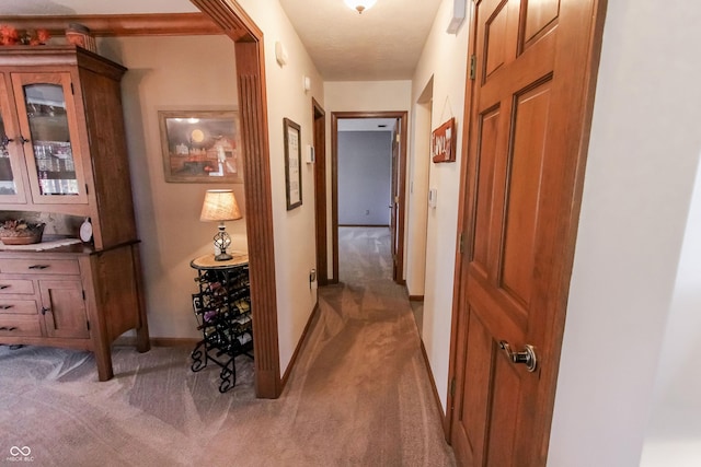 3819 S Village Dr, New Palestine, IN 46163 - corridor with light carpet and baseboards