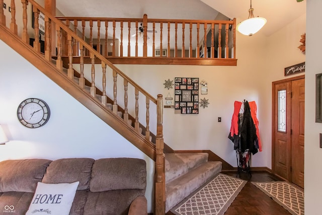 3819 S Village Dr, New Palestine, IN 46163 - foyer with high vaulted ceiling, baseboards, and stairs