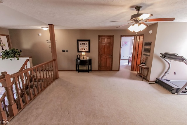 3819 S Village Dr, New Palestine, IN 46163 - hall featuring carpet, baseboards, and a textured ceiling