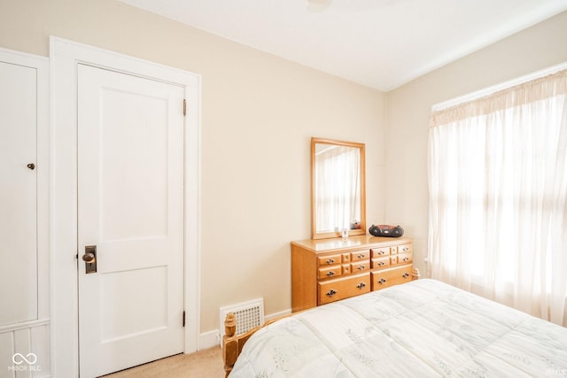 2007 Lincoln Ave, New Castle, IN 47362 - bedroom featuring multiple windows, light carpet, and baseboards