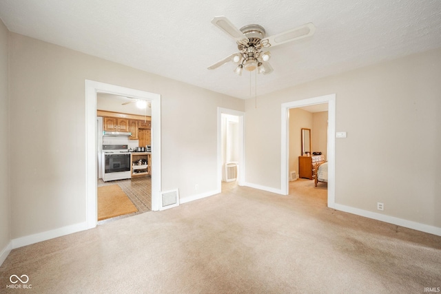2007 Lincoln Ave, New Castle, IN 47362 - unfurnished room with ceiling fan, light carpet, and baseboards