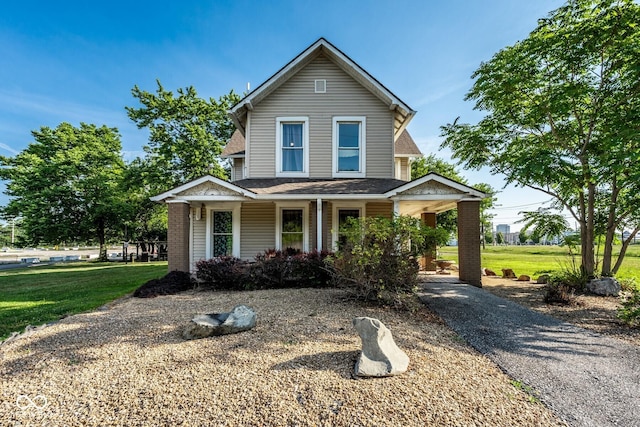 262 W Ray St, Indianapolis, IN 46225 - view of front of home with a front lawn, roof with shingles, and a porch