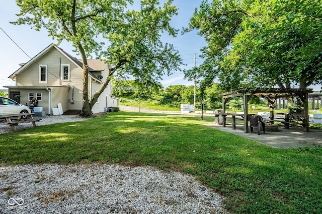 262 W Ray St, Indianapolis, IN 46225 - view of grassy yard with a pergola and a patio