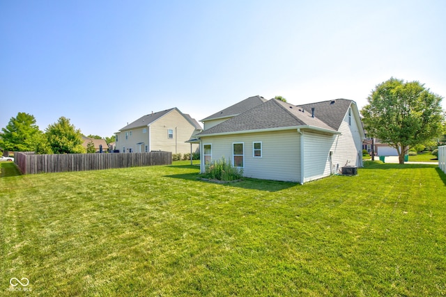 2234 Burgundy Way, Plainfield, IN 46168 - rear view of house with central AC and a shingled roof