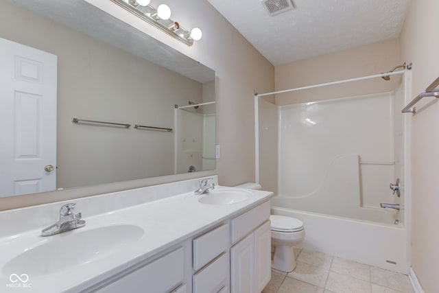 2234 Burgundy Way, Plainfield, IN 46168 - full bath featuring toilet, double vanity, shower / washtub combination, tile patterned floors, and a textured ceiling