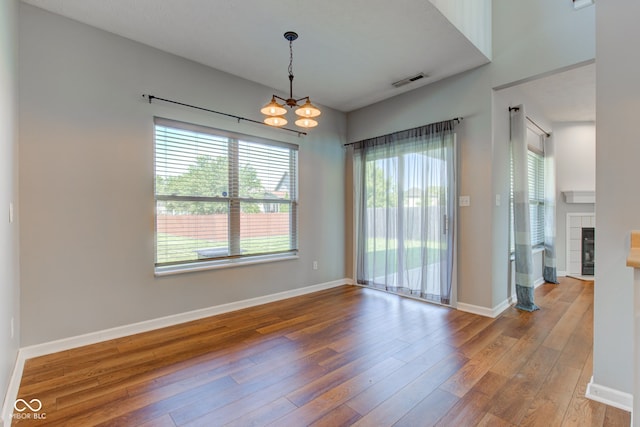 2234 Burgundy Way, Plainfield, IN 46168 - unfurnished room featuring hardwood / wood-style flooring, a chandelier, and baseboards