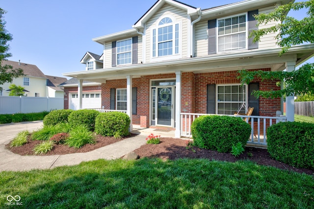 2234 Burgundy Way, Plainfield, IN 46168 - view of front of property with a porch, brick siding, and an attached garage