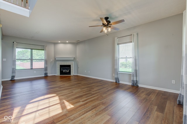2234 Burgundy Way, Plainfield, IN 46168 - unfurnished living room with ceiling fan, a fireplace, wood finished floors, and baseboards