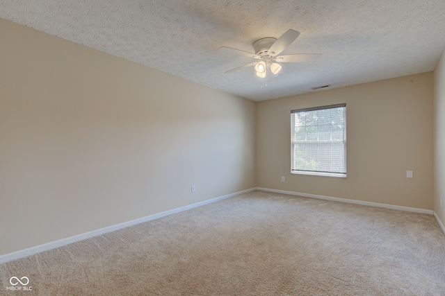 2234 Burgundy Way, Plainfield, IN 46168 - spare room featuring ceiling fan, light colored carpet, baseboards, and a textured ceiling
