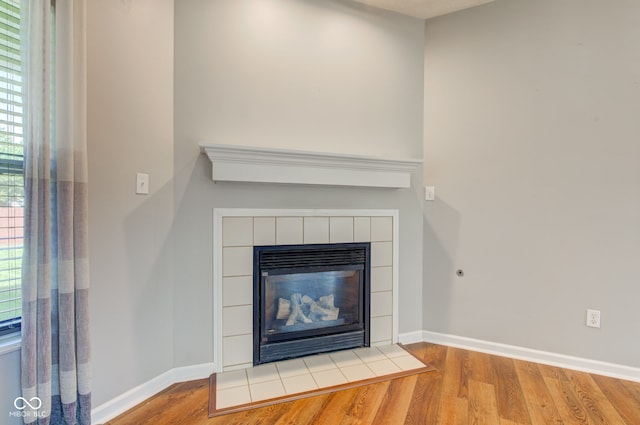 2234 Burgundy Way, Plainfield, IN 46168 - detailed view of wood finished floors, a fireplace, and baseboards