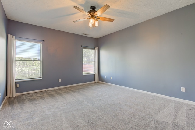2234 Burgundy Way, Plainfield, IN 46168 - empty room featuring carpet, a ceiling fan, baseboards, and a textured ceiling